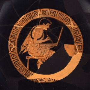 Tondo of Greek kylix; boy with writing tablet